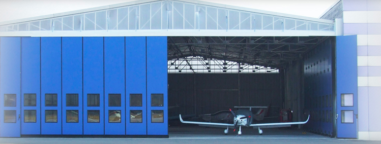 FLUX CORNER - Portone scorrevole ideale per hangar di aeroporti